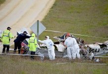 Investigators sift through plane wreckage