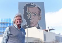 Theatre icon towers over city