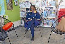 World at feet of young migrant