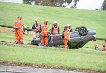 Driver hospitalised following highway rollover