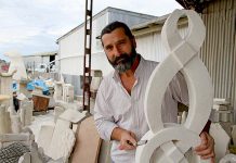 Sculptor shapes art society direction