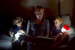 Matthew Emily And Tommy Izzard Reading By Torchlight Ready For Earth Hour  TBW Newsgroup