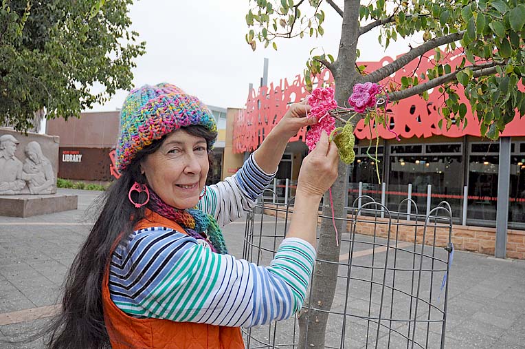 Yarn bombers bring burst of colour to city