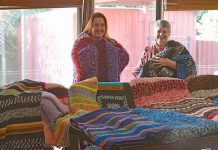 Knitter lends helping hand as hand-crafted blankets donated to ease winter chill Trudi And Amalia TBW Newsgroup