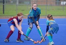 Tigers struggle to keep up with classy West in Division 1 hockey contest Strikers Brooklyn Hill And West Paige Chambers In A Tussle For The Ball While Wests Lauren Smith Awaits Her Opportunity20190727crop TBW Newsgroup