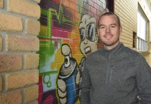 Business balanced with vibrant mural Brad Tilley And Mural (1)20190819 TBW Newsgroup