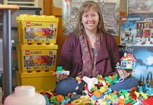 Emma picks up pieces to view a Lego house Emma Robinson (3)20190801 TBW Newsgroup