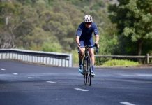 Cyclists battle weather in crater lakes climb