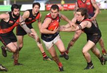 Roos win muddy battle