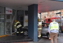 Car collides with news office door
