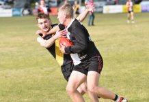 Hawks prevail in bottom-order battle