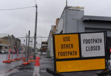 Community vows to fight for wall