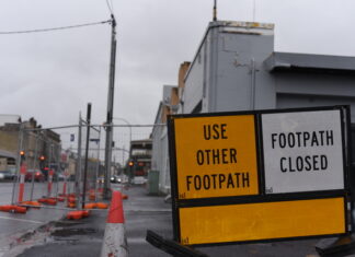 Community vows to fight for wall